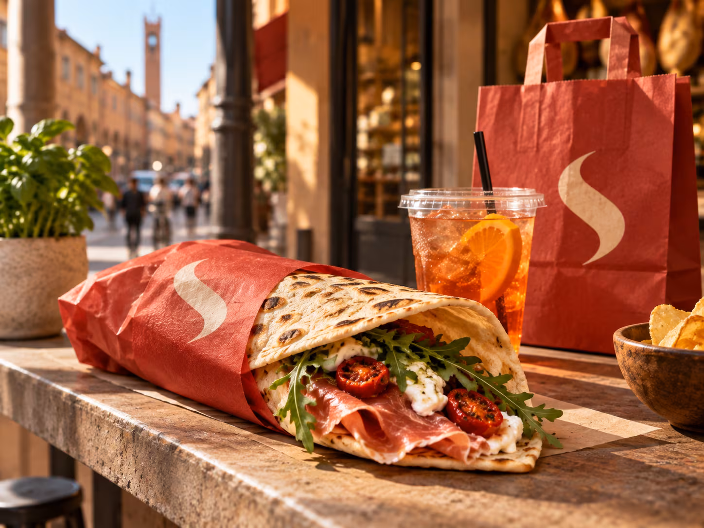 Piadina Spizzi in confezione da asporto rossa.